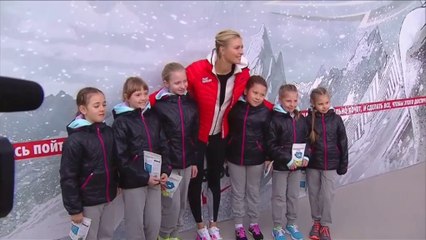 Sharapova returns home