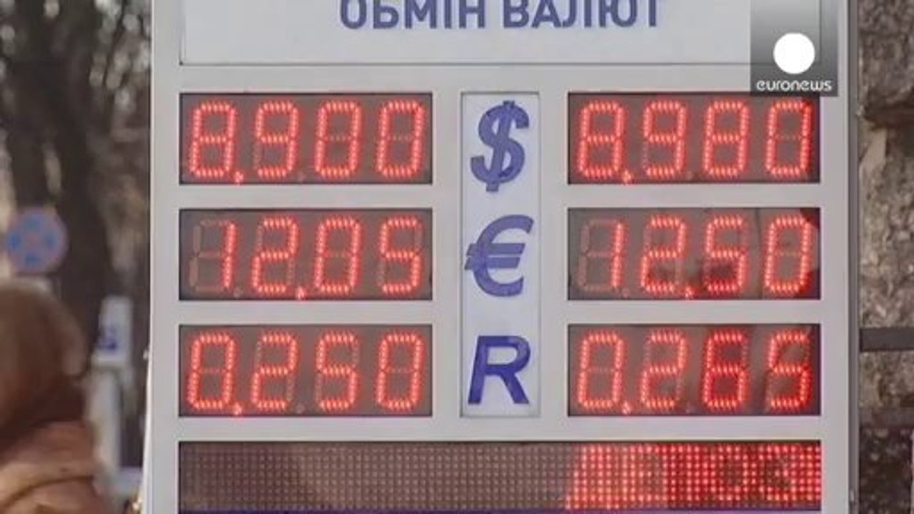 Kyiv tries to dampen currency fear as Fitch downgrades Ukraine
