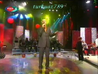 Emra AYGAN-Bir Kızıl Goncaya Benzer Dudağın