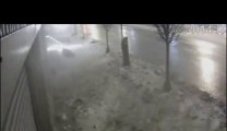 Pedestrian covered by snow on sidewalk... Crazy!