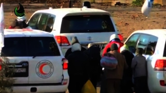 Syrians evacuate Homs as part of ceasefire, amid reports of attack