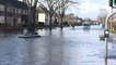 Oxford floods: residents take to dinghy as road floods