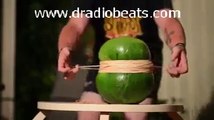 cutting water melon with rubber band