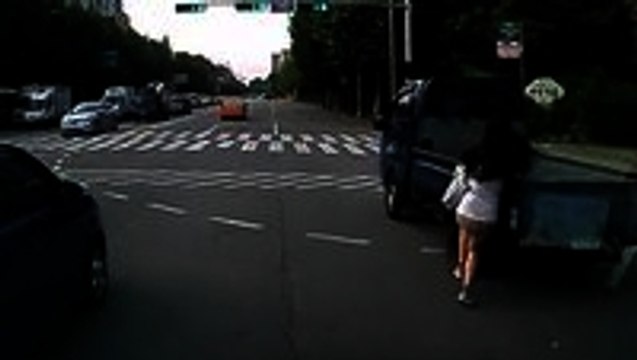 Woman on Phone Barely Dodges Car