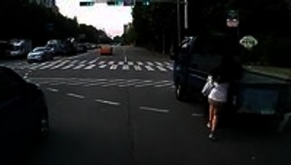 Woman on Phone Barely Dodges Car