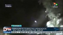 Rescatan a turistas aislados por la nieve en China