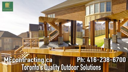 2 level cedar deck with wrought iron railings, pergola and stone walkout basement