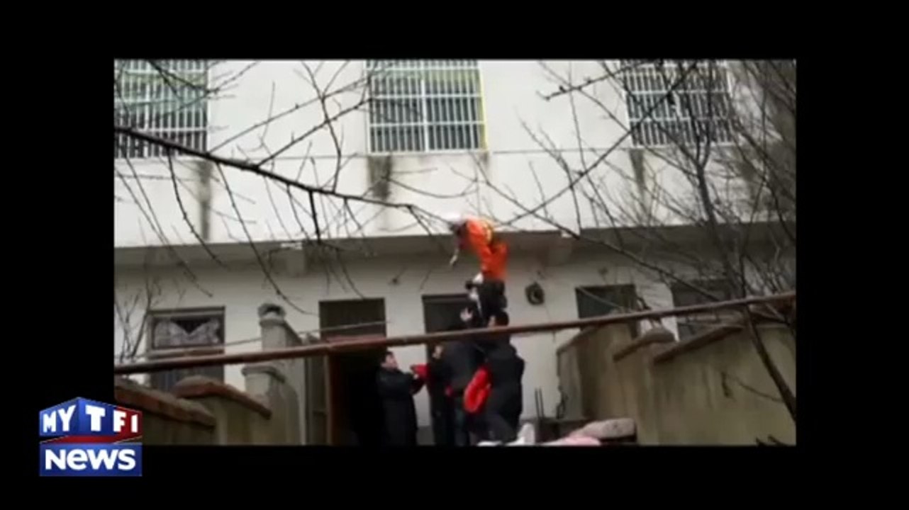 Chine : il sauve in extremis une femme qui veut se jeter de sa fenêtre