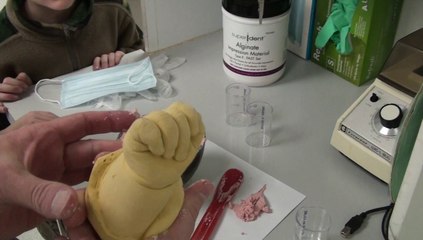 Mixing alginate dental impression material. Complete kit