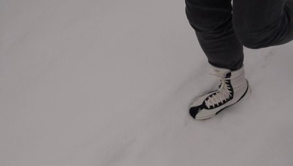 White&black Puma Schattenboxen boots in the snow