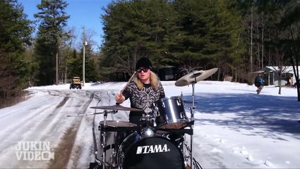 Drummer pulled by sled