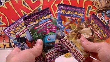 Opening 4 Pokemon B&W Dark Explorers Booster Packs!