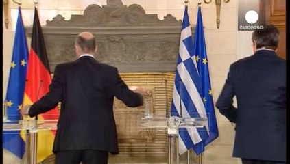 Merkel goes to Greece bearing congratulations and business support