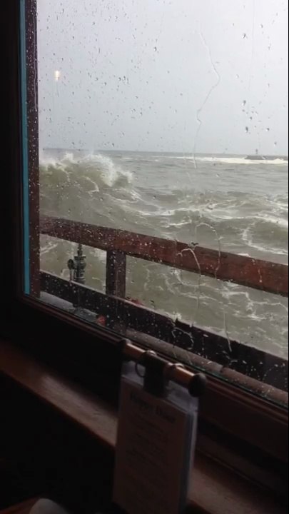 Large Wave Comes Through Restaurant