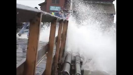 Storm Surge Causes Large Waves to Slam Pier
