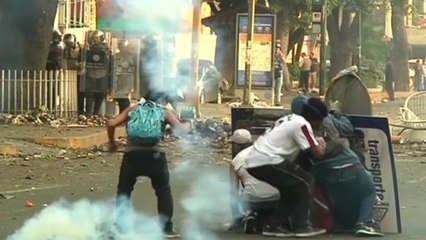 Protesters scuffle with police in Venezuela