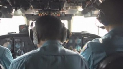 Families of passengers on board missing flight wait for news