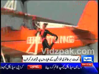 British Lady perform incredible stunts on biplanes in the skies over Kuwait
