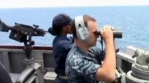 U.S. Navy scans ocean for missing Malaysian Airlines flight.