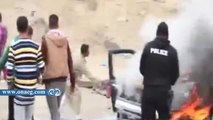 انصار الإخوان يشعلون النيران في سيارة شرطة بالسادس من أكتوبر