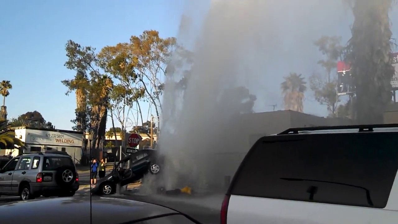 Car Crashes Into Fire Hydrant, Resulting Water Fountain Keeps It Up In The Air