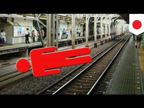Train runs over Japanese office worker but no one notices