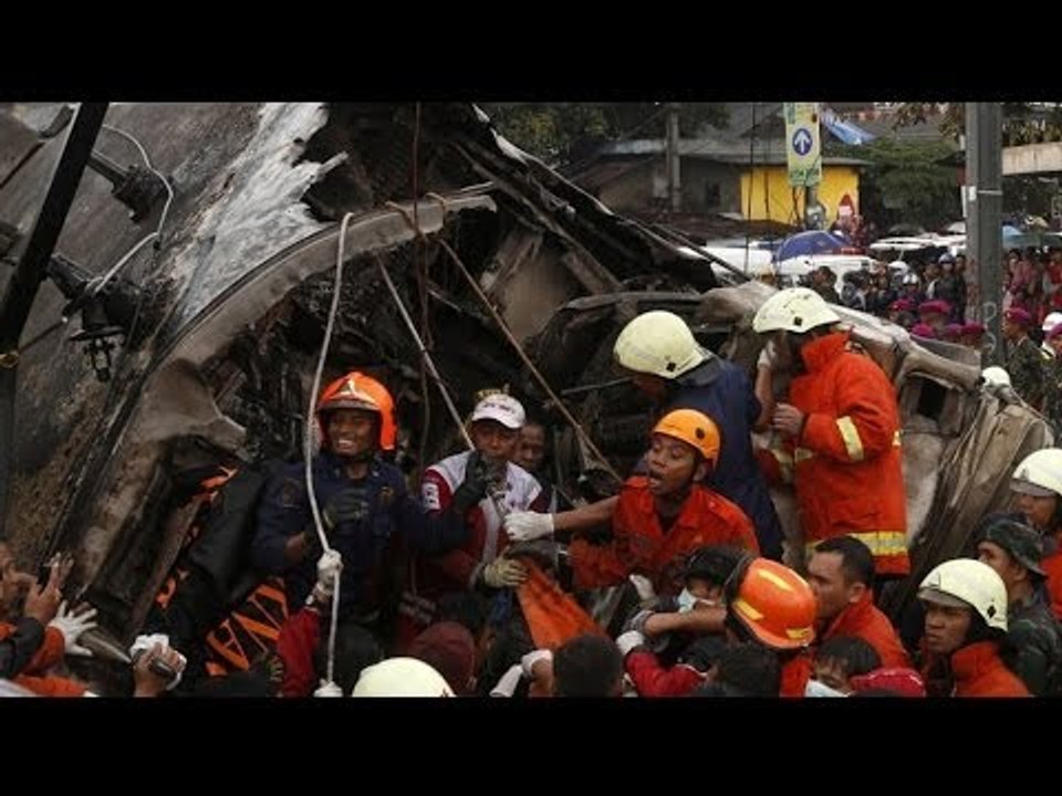 At least seven were killed in a train and truck collision in Jakarta