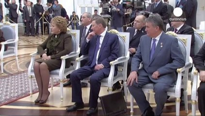 Putin formally signs Crimea into the Russian Federation