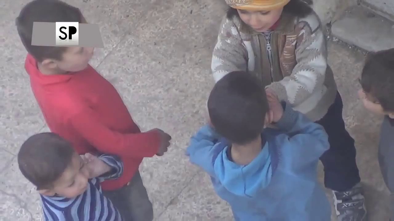 An_Orphaned_Child_Shares_A_Sandwich_with_His_Friends
