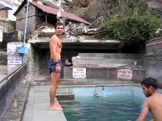 Trying a flip at the Vashist hot spring