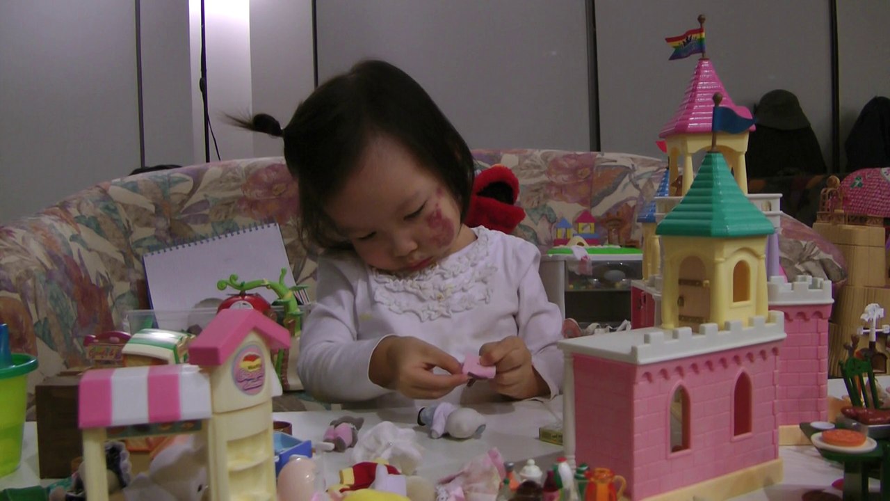 Girl Packing Backpack For Her Doll