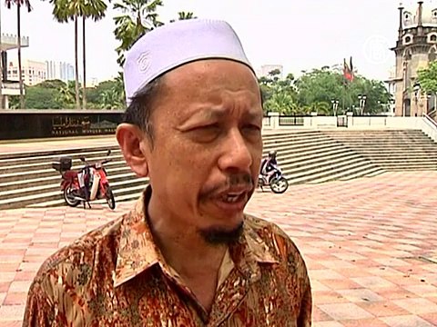 Малазийские мусульмане молятся за рейс MH370