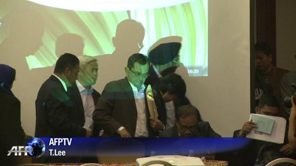 Chinese relatives clash with Malaysian officials