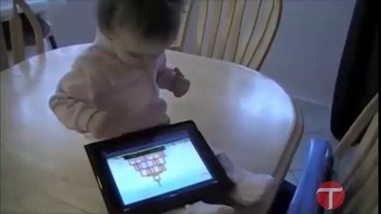 Little babay playing Angry Bird in tablet