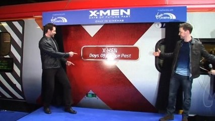 Hugh Jackman teases new film at train launch