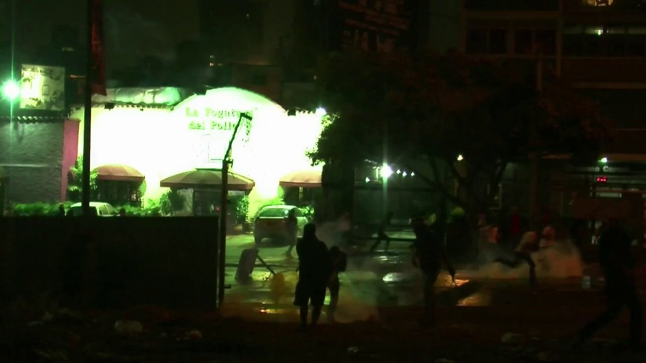 Clashes and arrests as anti-Maduro protests continue in Caracas