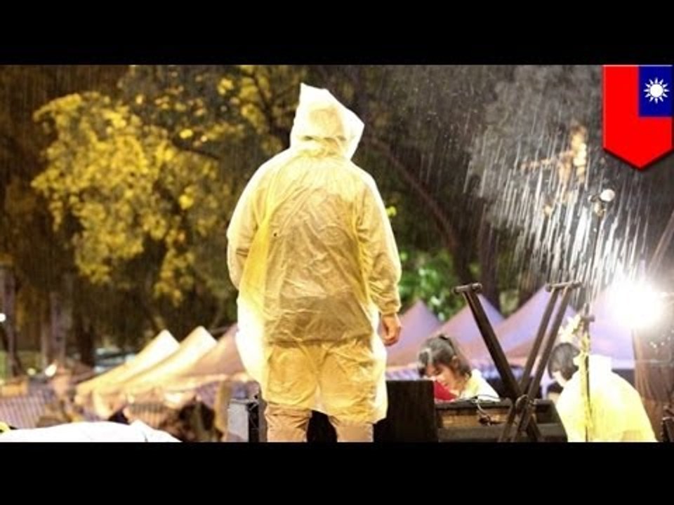 Taiwanese students continue to protest trade pact with China despite heavy rain