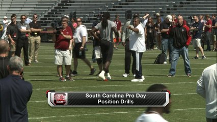Romeo Crennel works out Clowney during pro day