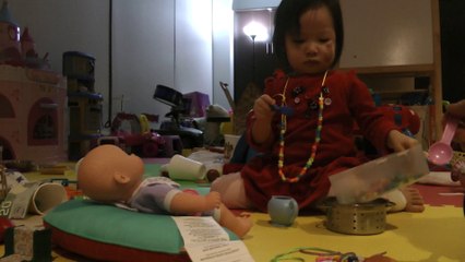 Girl Playing Her Alphabet Beads