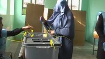 Afghan voters defy threats