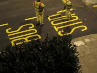 Workers Painting Signs Circulation in London