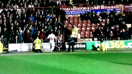 Crawly town player swings a punch at fan
