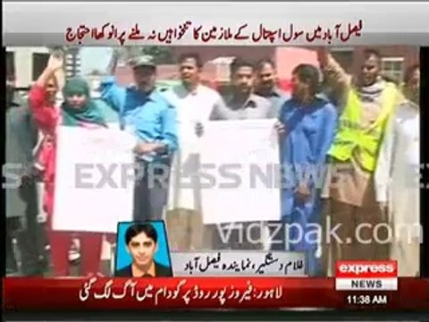 Civil Hospital employees Unique Protest , climb up to water tank in Faisalabad