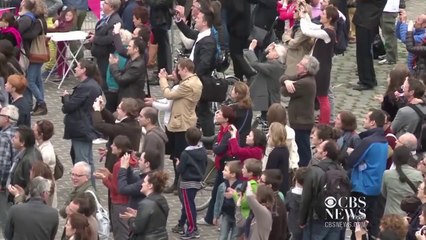 Tightrope walker crosses River Seine (HD)