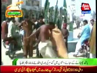 daharki Man carrying wheat bag with teeth