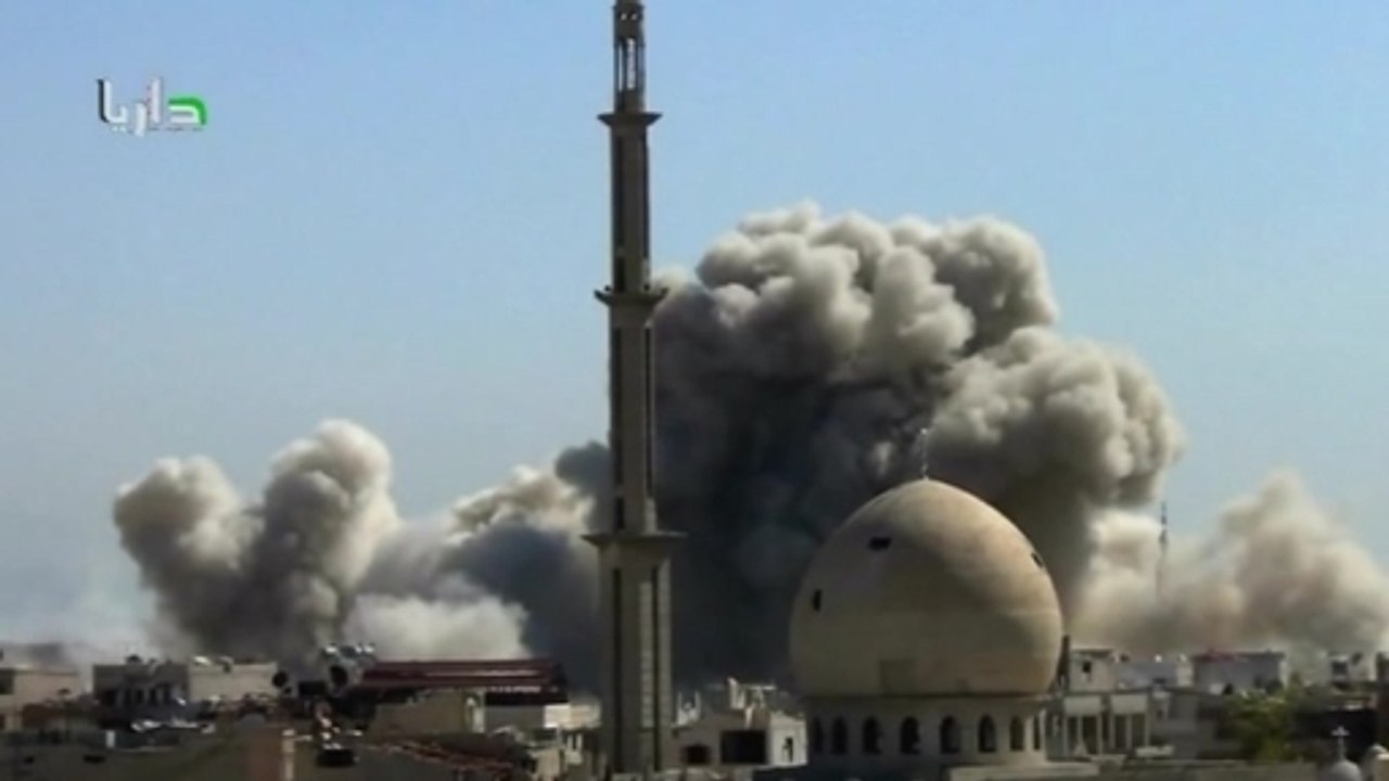 Bombs fall on Syria, as refugees protest upcoming election