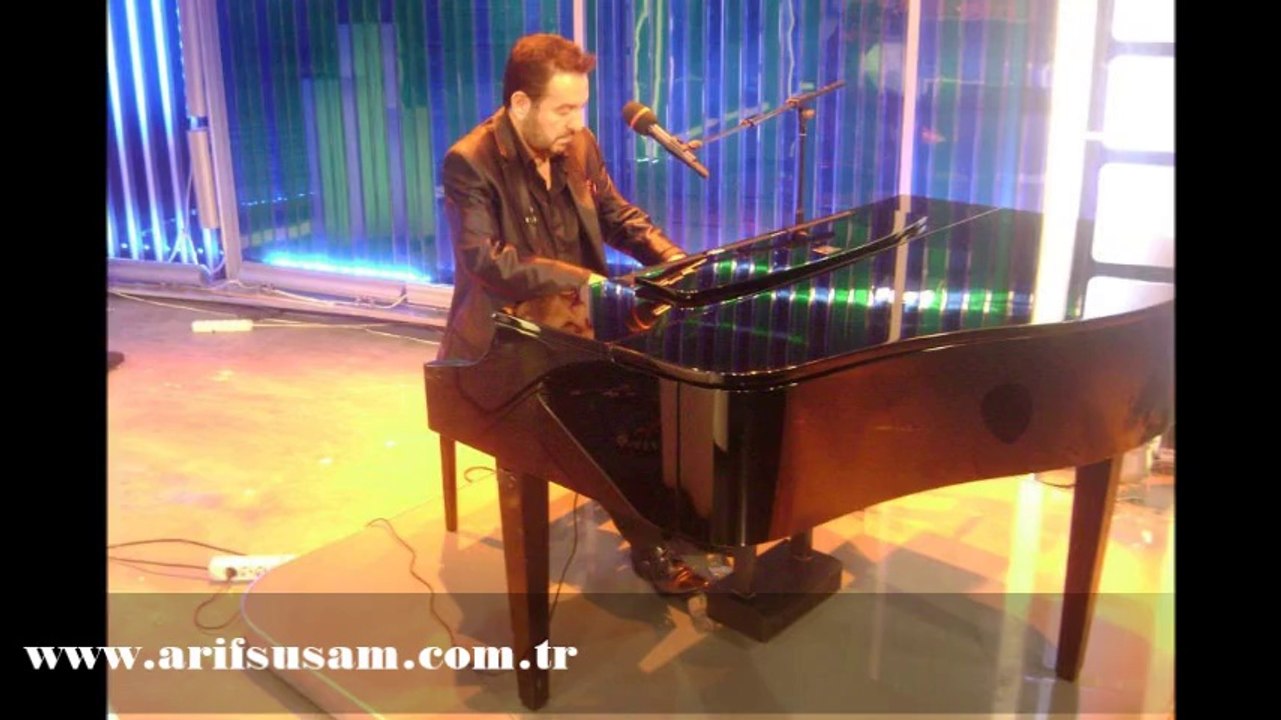 Arif Susam – ELİMDE DURAN FOTOĞRAFIN