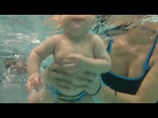 child training in swimming pool
