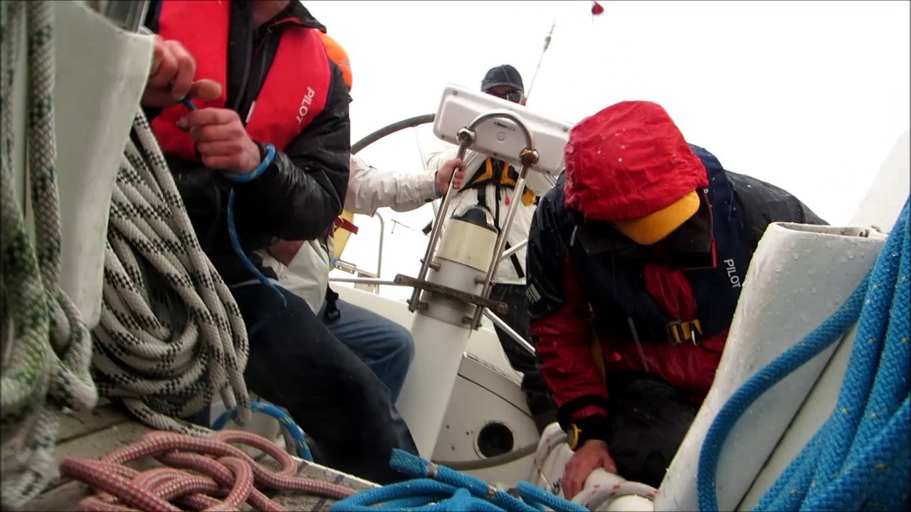 Getting hailed on around the cans, outside Shoreham Harbour. Sussex Yacht Club Spring Series, March 2014