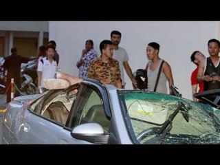 Man stuck in car after suicide jumper lands on vehicle
